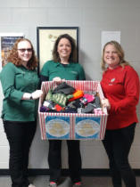 Dr. Kim, Jackie Giuliani, and Monicaf Fabbri with the donation to Forest Park School from our hat/mitten drive.